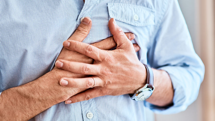 Man with hands on his chest