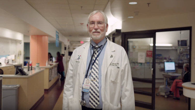 older white male standing in hospital setting
