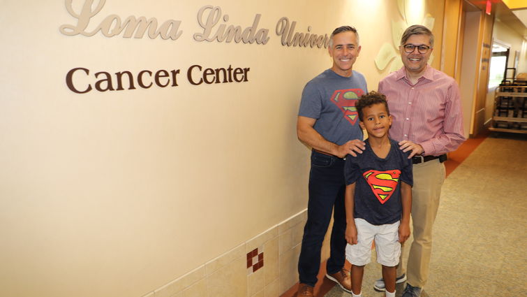 cancer survivor, student and doctor stand together