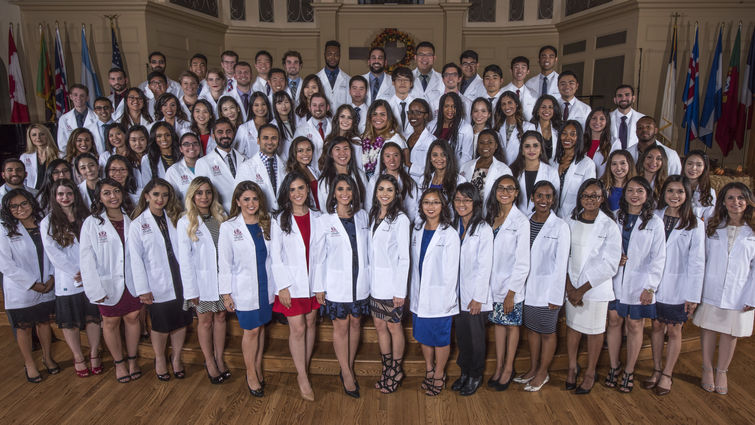 LLU School of Pharmacy class of 2021 Group of students in white jackets