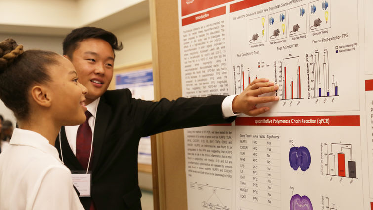 High school students present their research boards