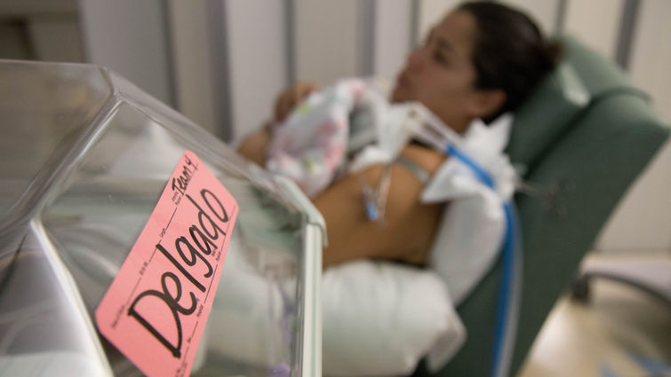 New mom Leticia Delgado holds her tiny baby, Emmarose Delgado, in the NICU at Loma Linda University Children’s Hospital.