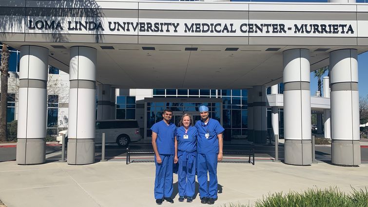 three surgeons standing