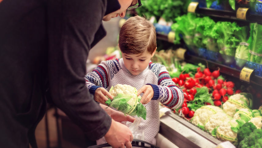 Father Grocery Shopping with son - stock photo