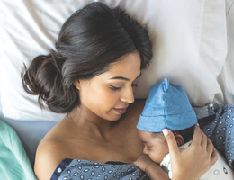 U.S. News & World Report badge alongside picture of a mother and baby