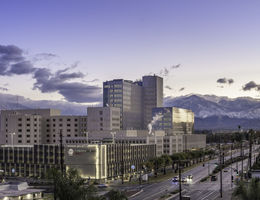scenic photo of medical campus with mountains in background