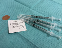 An arrangement of four flu vaccines.