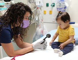 female doctor with toddler patient