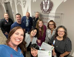 a group of hospital employees taking a selfie