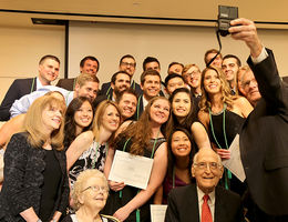 Roger Hadley, MD, dean of Loma Linda University School of Medicine, takes a selfie with the newest members of the Epsilon chapter of Alpha Omega Alpha moments after they were initiated into the honor medical society.