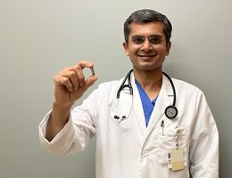 Dr. Harit Desai, associate director for the cardiac catheterization lab and structural heart intervention program at LLUMC – Murrieta, holds the world's smallest pacemaker.