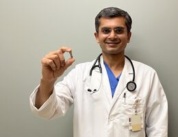 Dr. Harit Desai, associate director for the cardiac catheterization lab and structural heart intervention program at LLUMC – Murrieta, holds the world's smallest pacemaker.