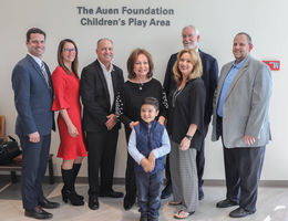 hospital administrators, city representatives, a the auen foundation cut ribbon