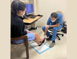Dr. Mohammed Reza Amini consults a patient about chronic venous insufficiency.