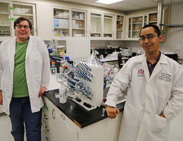 Carson Whinnery and Nick Sanchez in the lab where they conduct research