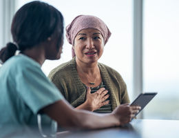 Female patient speaking with care provider.