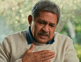 Shot of a senior man suffering from chest pain at home - stock photo