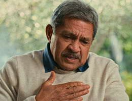 Shot of a senior man suffering from chest pain at home - stock photo