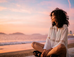 Woman staring out into the ocean. 