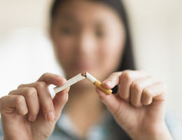 Girl breaking a cigarette