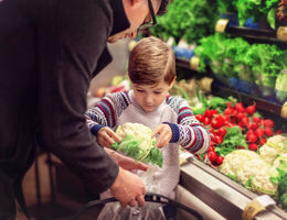 Father Grocery Shopping with son - stock photo