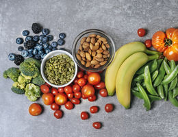 Assortment of colorful fruits, vegetables, and nuts.