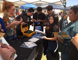 Graduate student Macy Westbrook, MPH(c) from the School of Public Health educates high school students on how the air pollution in the Eastern Coachella Valley affects their health.