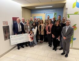 WCCC committee and LLUCH staff group together for a photo while holding check donation