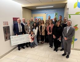 WCCC committee and LLUCH staff group together for a photo while holding check donation