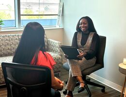 two people in a therapy session