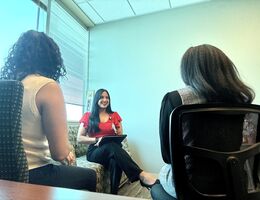 three people sit in a therapy session