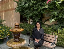 Paola Vidauri Luna sitting outside of the behavioral health center