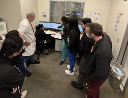 Dr. Bannout with residents and medical students at the Epilepsy Monitoring Unit in LLUH Medical Center Dr. Bannout, in a white coatm with a group of students and residents during a teaching session about seizures