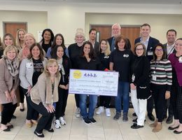 Loma Linda University Children's Hospital staff and representative from Spirit of Children stand together in a group for a photo with the check