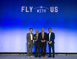 Dr. Francis Chan, Dr. Albert Kheradpour, Joe Mascari, and Thai Dinh, pose on stage for photo with award