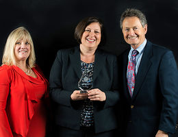 Barbara Couden Hernandez, PhD, center, receives the Medicus Integra Award. With her are Dianne McCallister, MD, left, CMO at Medical Center of Aurora, Colorado, and Ted Hamilton, MD, vice president of medical mission, Adventist Health System.