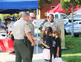Police officers interact with children during National Night Out event