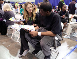Before leaving the event, participants met with volunteers who provided lifestyle counseling. Here Sara Kashian, a student in the department of nutrition and dietetics, School Allied Health Professions, counsels a participant.