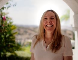 Patricia Bianchi smiles at her home.