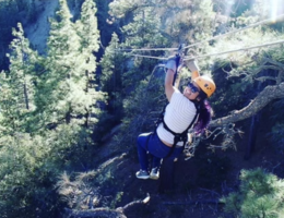 Wendy Bazail smiling before riding down a zipline