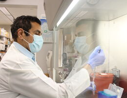Dr, Hisham Abdel-Azim working in a clinical science lab