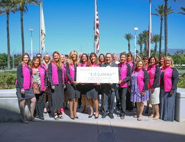 group holding a check