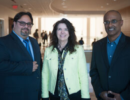Three people standing together