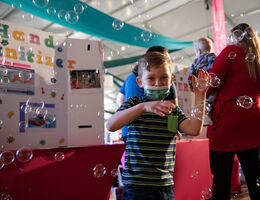 Young boy playing with bubbles