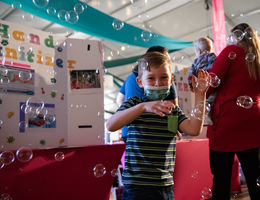 Young boy playing with bubbles