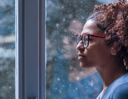 woman looking out the window