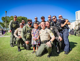 Loma Linda University Children’s Hospital patient, Rocky Zepeda, 6, of Victorville, with his new friends and role models at the 20th annual Cops for Kids Fly-In on Tuesday, Oct 16.