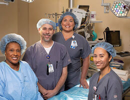 four nurse employees pose for photo