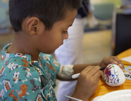 LLUCH patient, Emmanuel De la Paz, 5, of Coachella, enjoyed the painting activity at Fall Into Reading on Sept. 17 in the hospital lobby.