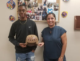 doctor and patient hold life saving helmet